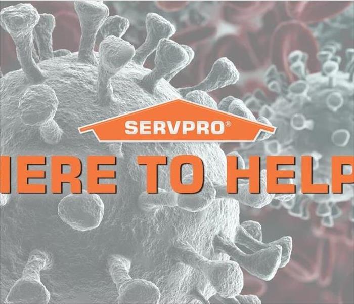 SERVPRO house logo with here to help in orange letters and a grey background.
